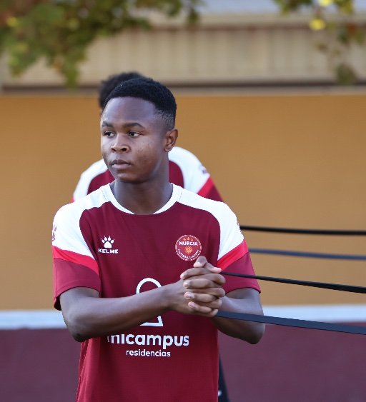 murcia football academy player resistance band warmup