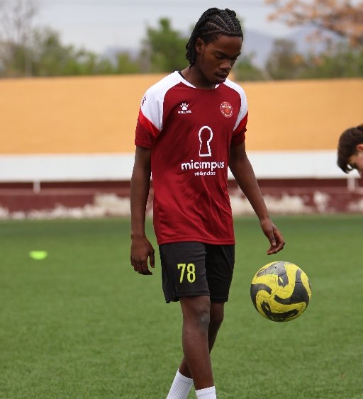 Murcia Football Academy player controlling ball during football training in Spain