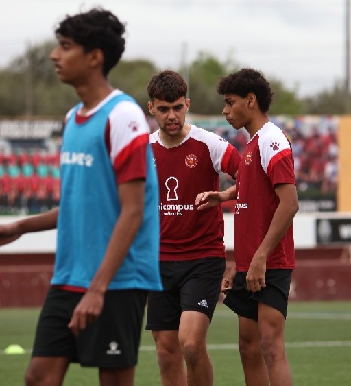Murcia Football Academy players speaking during training session in Spain