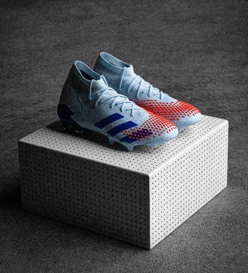 light blue football boots on display box