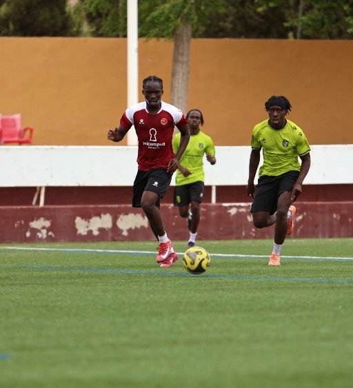 murcia football academy player sprinting with ball