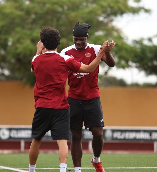 murcia football academy players celebrating during training