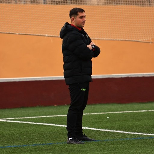 football coach observing training for soccer recruiting video