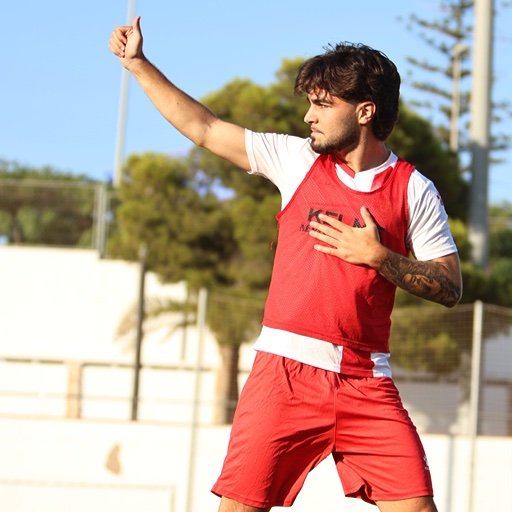 football player training at academy in spain