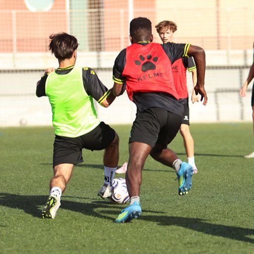 football players competing for ball during 5 4 1 formation training