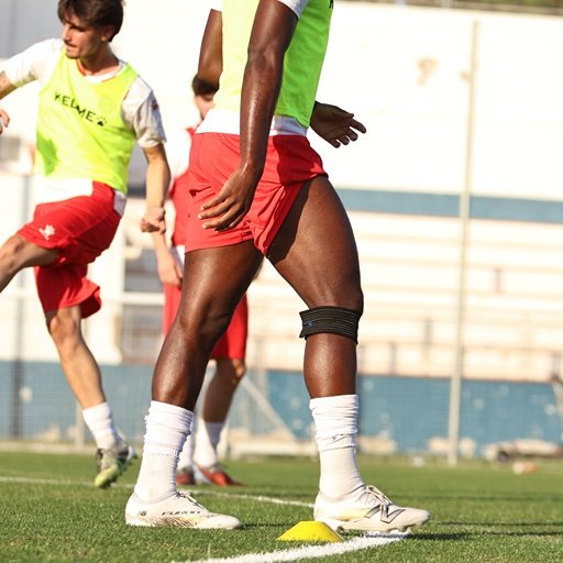 footballer training with cones for footballers who started late